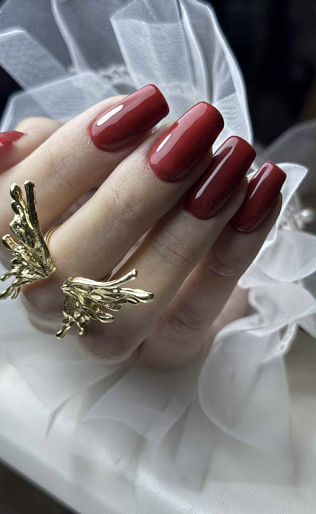 Red square nails with gold ring